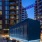 The exterior of the Illume Apartments in Navy Yard Washington DC, featuring a view of the modern facade and the sky at dusk.