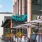 Photograph of people outside dining at a restaurant called 